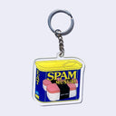 Die cut acrylic keychain of an illustrated can of Spam with Spam Musubis on the front. "Giant Robot" is written on the seaweed wrap in small white cursive.