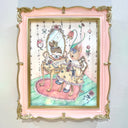 Watercolor illustration of a cute, cartoon style rabbit sitting at a mirrored vanity with an open book on it. She wears a frilly dress and a mirrored reflection shows a differently colored bunny with a crown. Piece is inside an ornate pink frame.