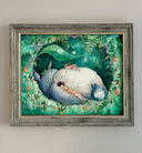 Illustration of a fluffy Totoro, laying in an alcove made of forest greenery and flowers. Atop him is a small girl and another young girl sleeps on his arm.