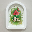 Watercolor painting of 2 cute, cartoon style dogs sitting in a grassy space with a large red flower towering above them with luminescent bulbs. Framed in a white arch shaped frame.