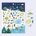 Set of illustrated stickers with nature and outdoor scenes on a blue background