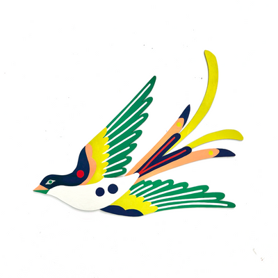 Die cut, brightly painted wooden sculpture of a swallow, with its wings extended out. Its body is white and navy with yellow wings and green wingtips. Its tail feathers out, peach and navy with yellow detailing.