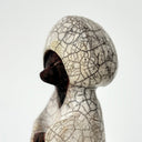 Ceramic fox figurine with a cracked glaze finish on a white background
