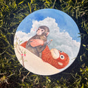Illustration of a monkey holding onto a plush orangutan, while holding a flower and looking sadly backwards, with a cloudy sky behind it.