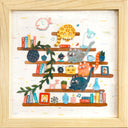 Cut paper artwork of several floating book shelves with books, framed pictures, trinkets, plants and 4 chubby cats. The cats are of all different colors and look around. Piece is in wooden frame.
