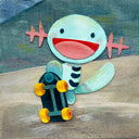 Paper cut illustration of a Pokemon, with a very happy expression riding a skateboard.