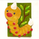 A whimsical hand-painted illustration of a cute yellow-orange caterpillar with red spots, a red beak, and white horns, set against a green background with a brown branch and green leaves.