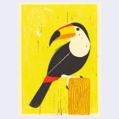 Relief print of a toucan perched on a wood post with a bright yellow background.