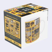 Mug with a wrap around design of video game consoles and old game cartridges. In its product packaging.