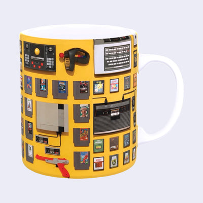 Mug with a wrap around design of video game consoles and old game cartridges. 
