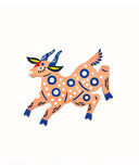 Die cut, brightly painted wooden sculpture of a folklore style deer, peach colored with dark blue and white polka dot patterns.