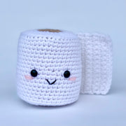 Crocheted roll of toilet paper with a cute smiling face.