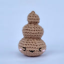 Crocheted poo swirl with a cute emotive face.