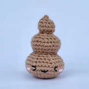 Crocheted poo swirl with a cute emotive face.