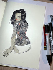 Illustration on solid white background of a woman, sitting on the ground in only white underwear, looking back at the viewer. Her back is covered entirely with traditional Japanese art style tattoos. Shown with pens and pencils on a workspace.