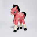 Ceramic sculpture of a pink horse with white star patterning on its body, it has white and black hooves and a black mane and tail.