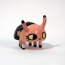Small ceramic sculpture of a pink and black bug with a cute cartoon face.