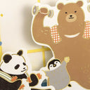 Cartoon bear, panda, and penguin cutouts on a light background