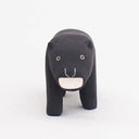 Wooden figurine of a black panther, with a growling expression.
