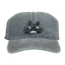 A gray washed cotton baseball cap featuring an embroidered character face on the front, set against a plain white background.