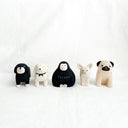 Five animal figurines in various poses on a white background