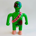 Green toy figure with a pink sash on a white background