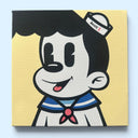 A square artwork featuring a stylized cartoon character with black hair, a white face and shirt, blue sailor collar stripes, and a red bow tie on a pale yellow background, shown against a light blue wall.