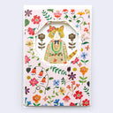 Birthday card with pink background and colorful flowers, revealing a cutely dressed cat.