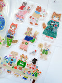 Set of colorful animal-themed stickers on a white background