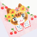 Illustration of a cat face with flowers and cherries on a pink background