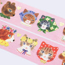 Decorative washi tape with cartoon animal characters on a pink background
