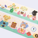 Decorative washi tape strip with cartoon animals and objects on a white background