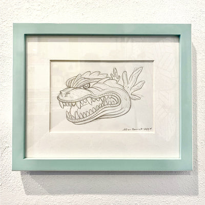 Refined graphite sketch drawing of a Godzilla head, with an open mouth and teeth showing. It's matted and in a mint colored frame.