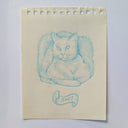 Hand-drawn cat illustration on a piece of paper with 'sup?' text.