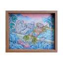 Framed artwork of a seal taking a bath in a bathtub with a spread of sea food in front of it. Water flows out of the tub.