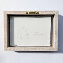 Back view of a framed artwork of a dog.