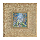 Colorful illustration of a person sitting on a rock reading a book, leaning up against a wolf with mystical trees and light in the background. Piece is in a very decorative frame.