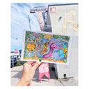 Colorful illustration of kaiju held up in front of a store with visible branding.