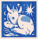 Blue ink risograph print of a calf laying on the ground cuddled up into itself - it has a heart pattern on its back fur.