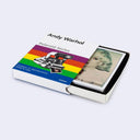 Andy Warhol Polaroid Series book with a colorful cover on a white background