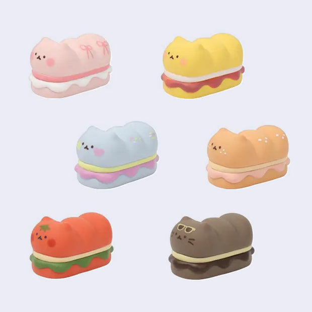 Set of cute, cartoon-style sandwich-shaped cat figurines with different colorings.
