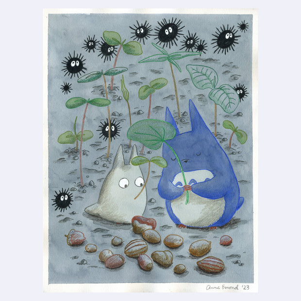 Illustration of 2 small chibi Totoros, one blue and one white holding leaves. They stand around different tree nuts and rocks, with sparse plant sprouts around them. Spiky black dust sprites float nearby.