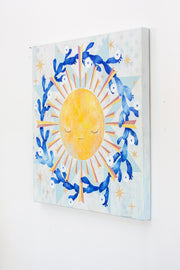 Painting of a yellow sun with graphic style rays coming off of it. A wreath of blooming cacti surround the sun. Background is painted white and blue like a quilt style pattern.