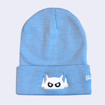 Sky blue beanie with a white embroidery on the front fold of a Big Boss Robot head.
