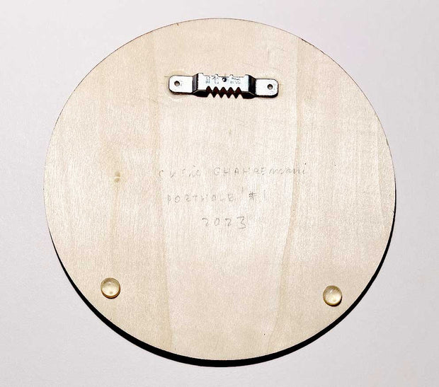 Back of circular wooden panel, with a sawtooth mounting hanger glued on and the artist's name in pencil.