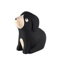 Black dog-shaped wooden sculpture on a white background.