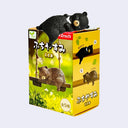 Toy bear figure on top of its packaging box with 'Spirits' branding.