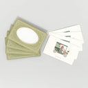 Set of 4 greeting notecards with illustrations of a bear driving an old timey car with a bird on the hood and matching green envelopes.