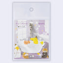Keychain with cartoon fox taking a bubble bath with cucumbers over his eyes and a small squirrel