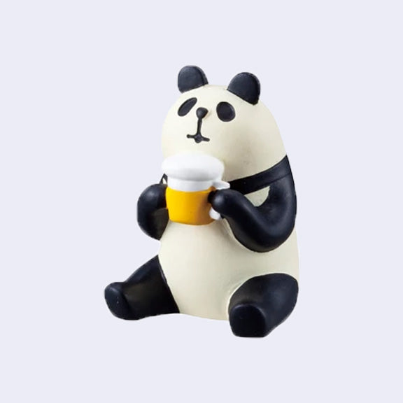 Small figure of a sitting panda, holding a frothy beer mug in its hand.
